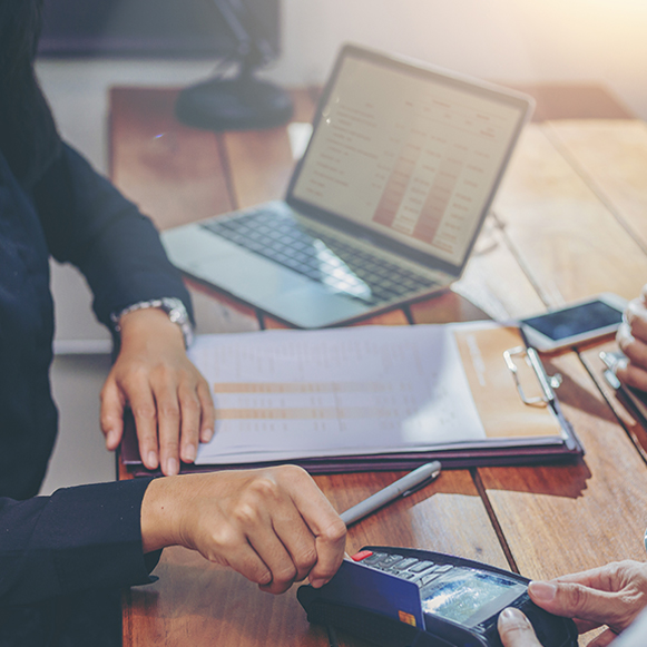 Person scanning credit card